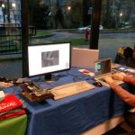 Photo of FOSDEM booth with Tobias