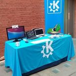Photo of table with KDE logos